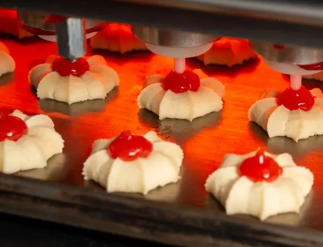 Jak zapobiegać rozlewaniu się nadzienia podczas automatycznego formowania ciastek?